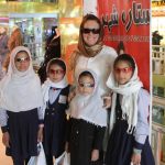 Wendy and girls at a mall in Kabul after purchasing sunglasses.